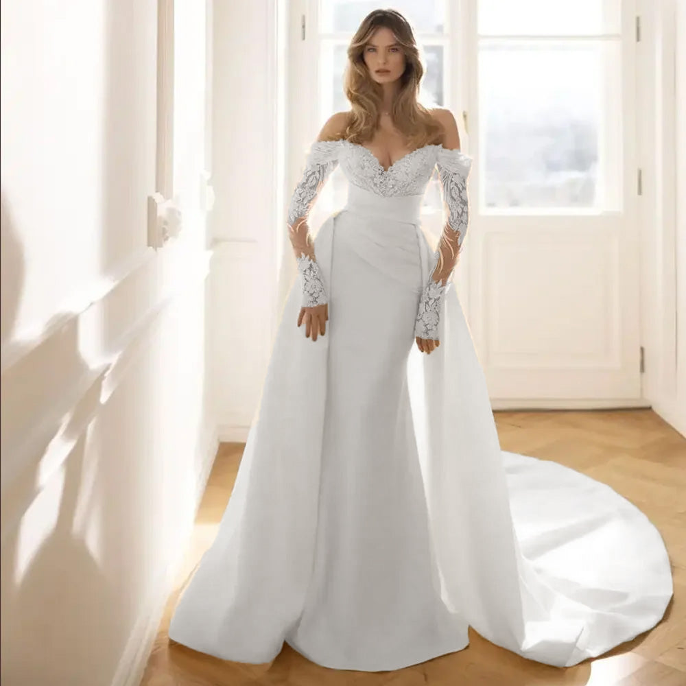 Side profile of a gorgeous long-sleeve mermaid wedding dress on a mannequin, highlighting the elegant fit-and-flare bridal silhouette.