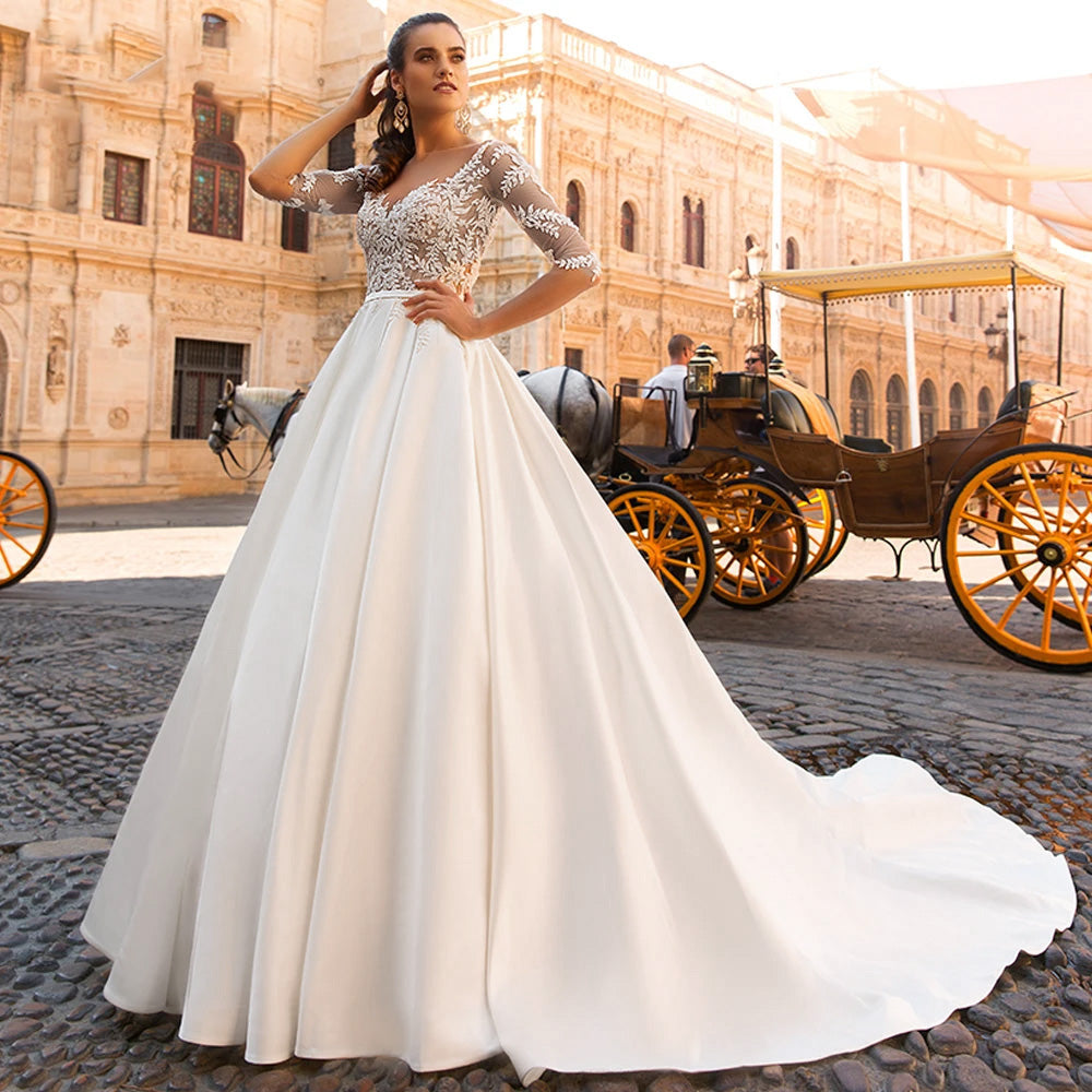 Full-body view of a vintage-style A-line bridal gown featuring delicate half sleeves, beaded appliques, and a classic silhouette.