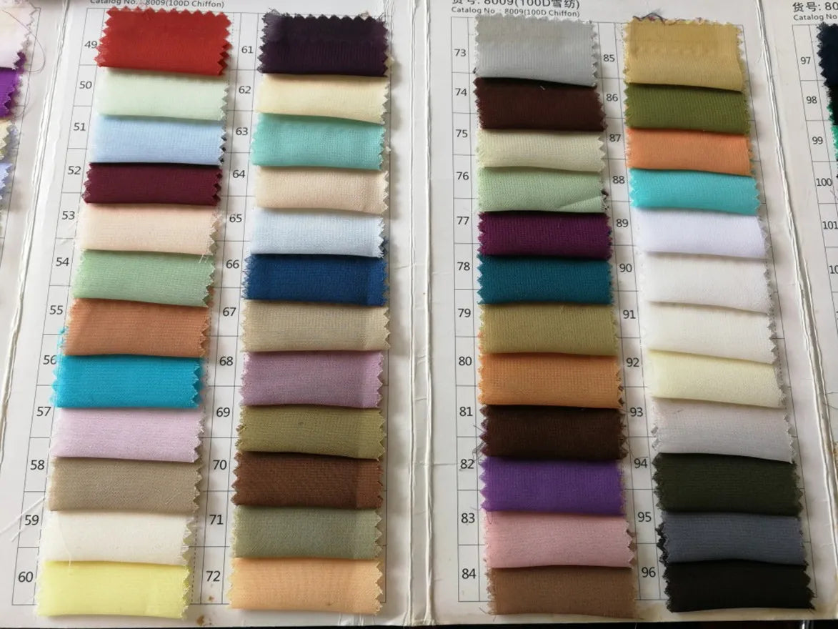 100D chiffon fabric color swatch chart displaying numbered textile samples in various shades for custom wedding dress and bridal jumpsuit orders.
