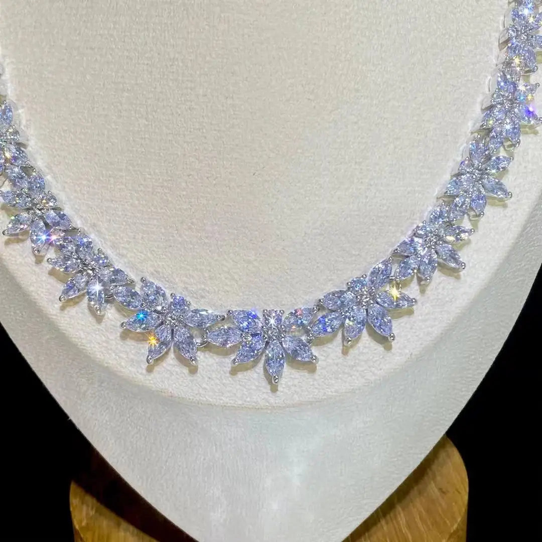 Detailed view of the elegant marquise crystal floral dropdown statement earrings from a 2pcs bridal jewelry collection.