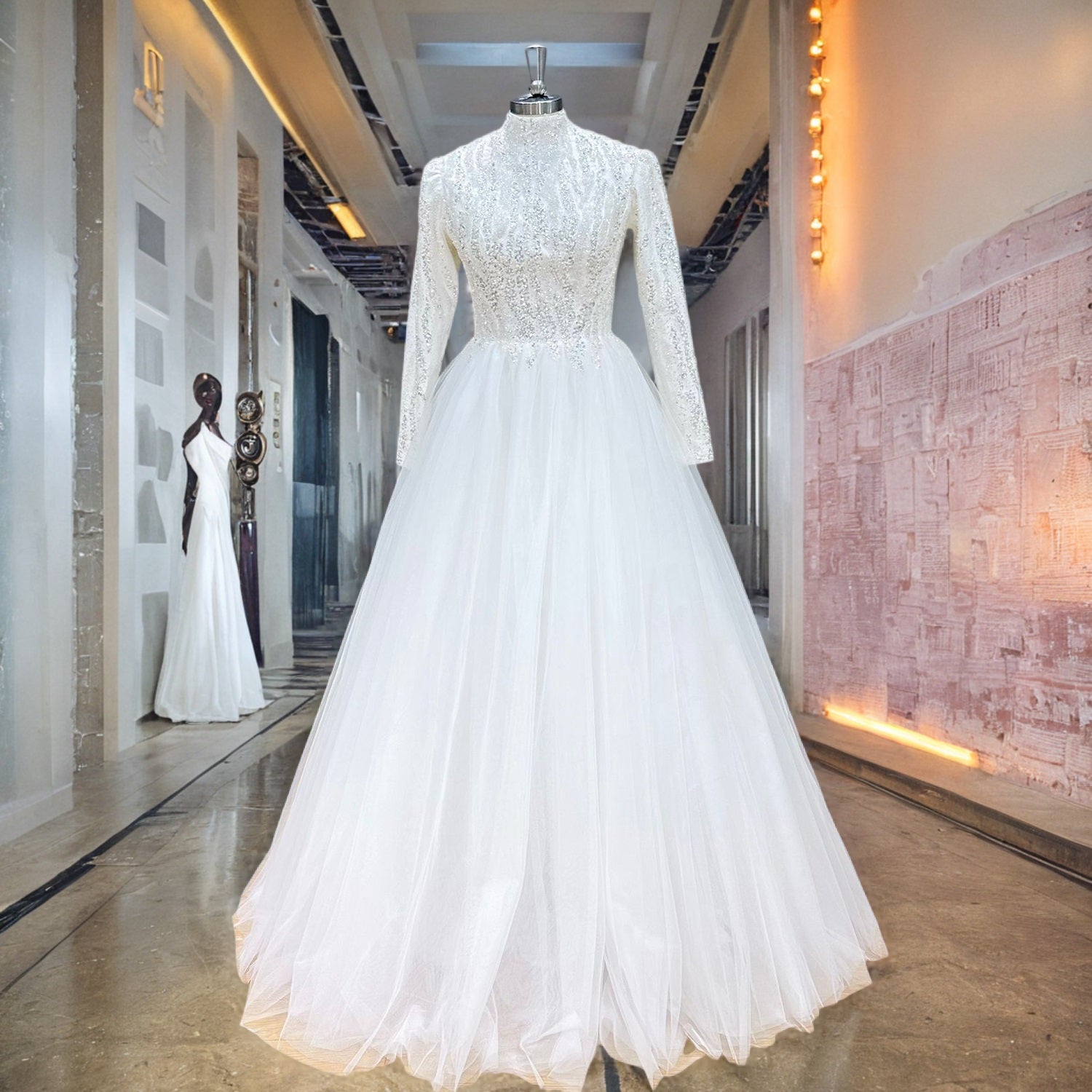 High-neck long-sleeve A-line wedding dress with intricate silver sequin patterns on the bodice, displayed on a mannequin in a bridal showroom hallway.