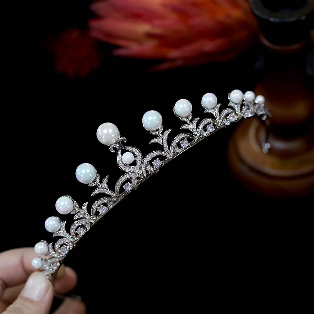 Detailed side profile of a silver-plated bridal headpiece hairband, showing the precise curve of the gem-encrusted framework.