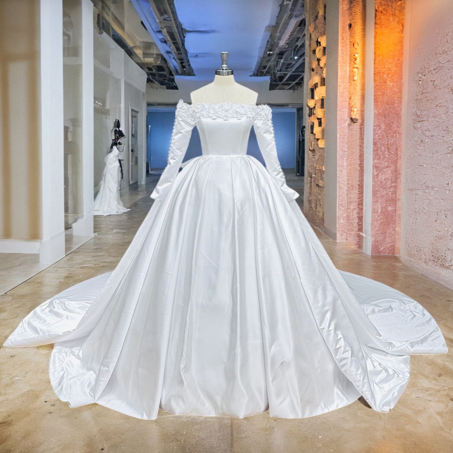 Full-length front view of a luxury off-the-shoulder satin wedding dress with structured pleats and a voluminous ball gown skirt on a mannequin.