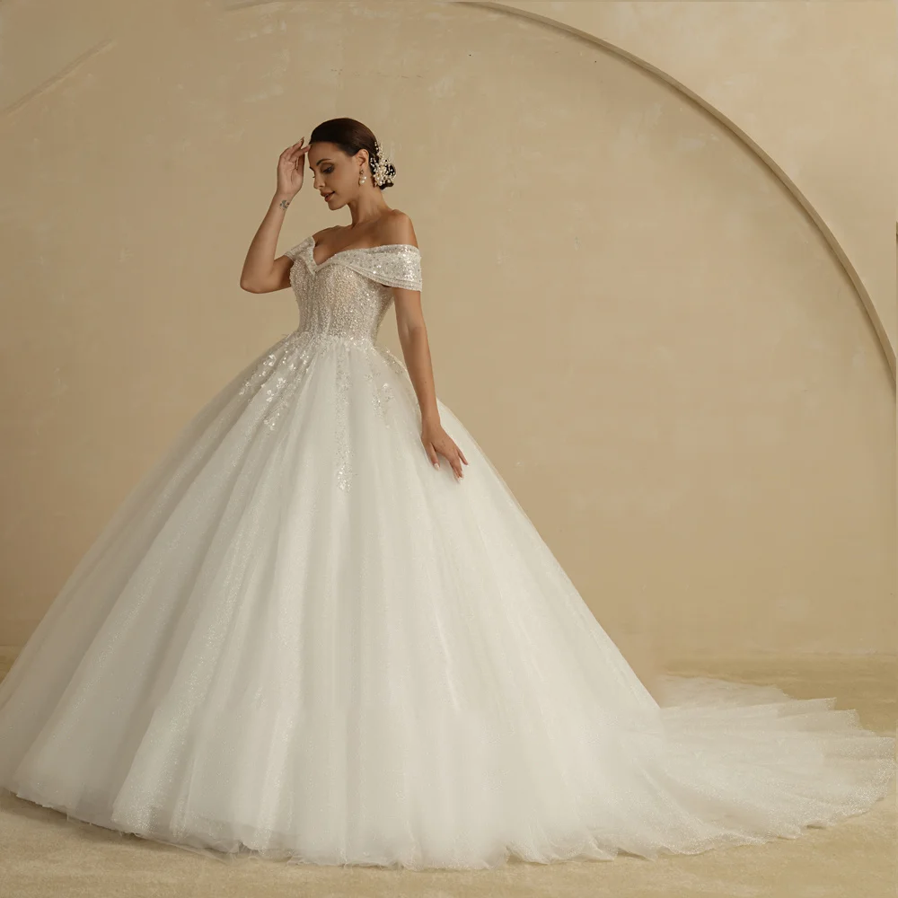 A front-facing view of a sleeveless ivory princess wedding dress with a sweetheart neckline, bodice beading, and a classic A-line silhouette.