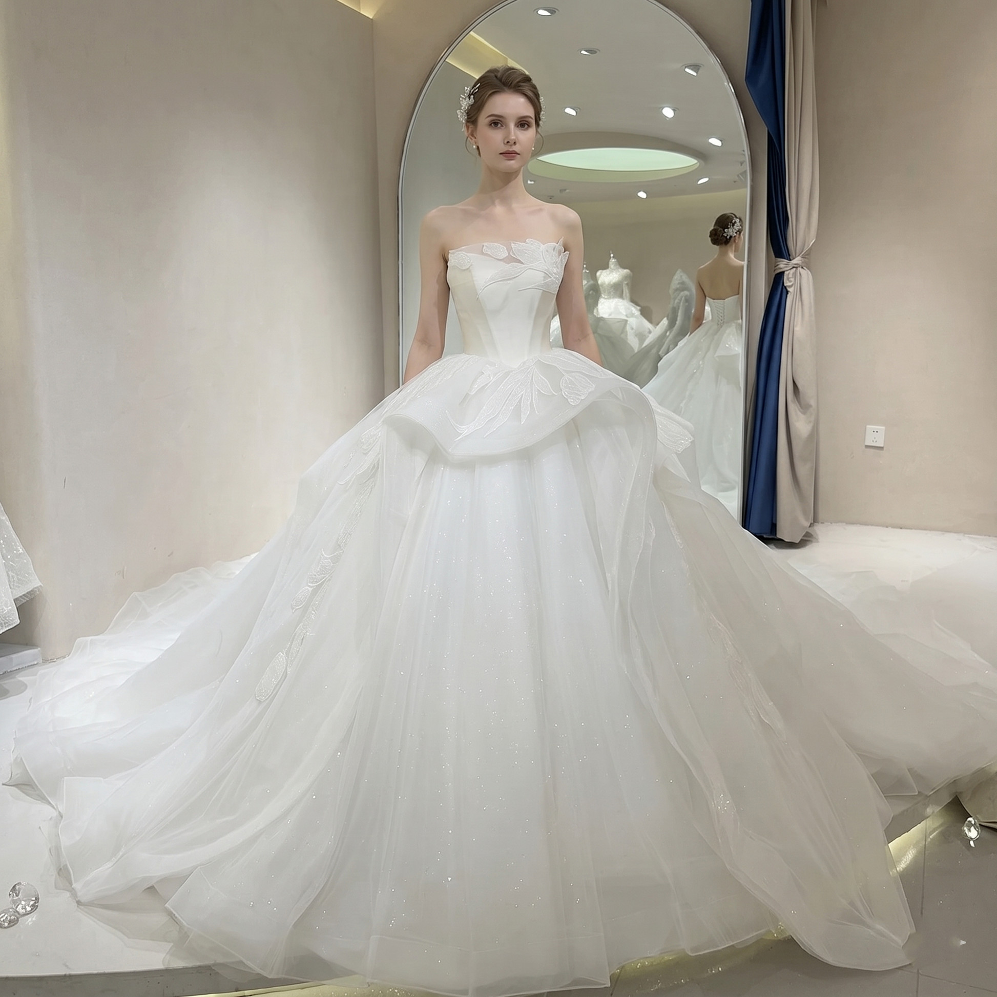 Full front view of a strapless ivory glitter princess wedding dress with a sweetheart neckline and a voluminous ball gown skirt on a mannequin.