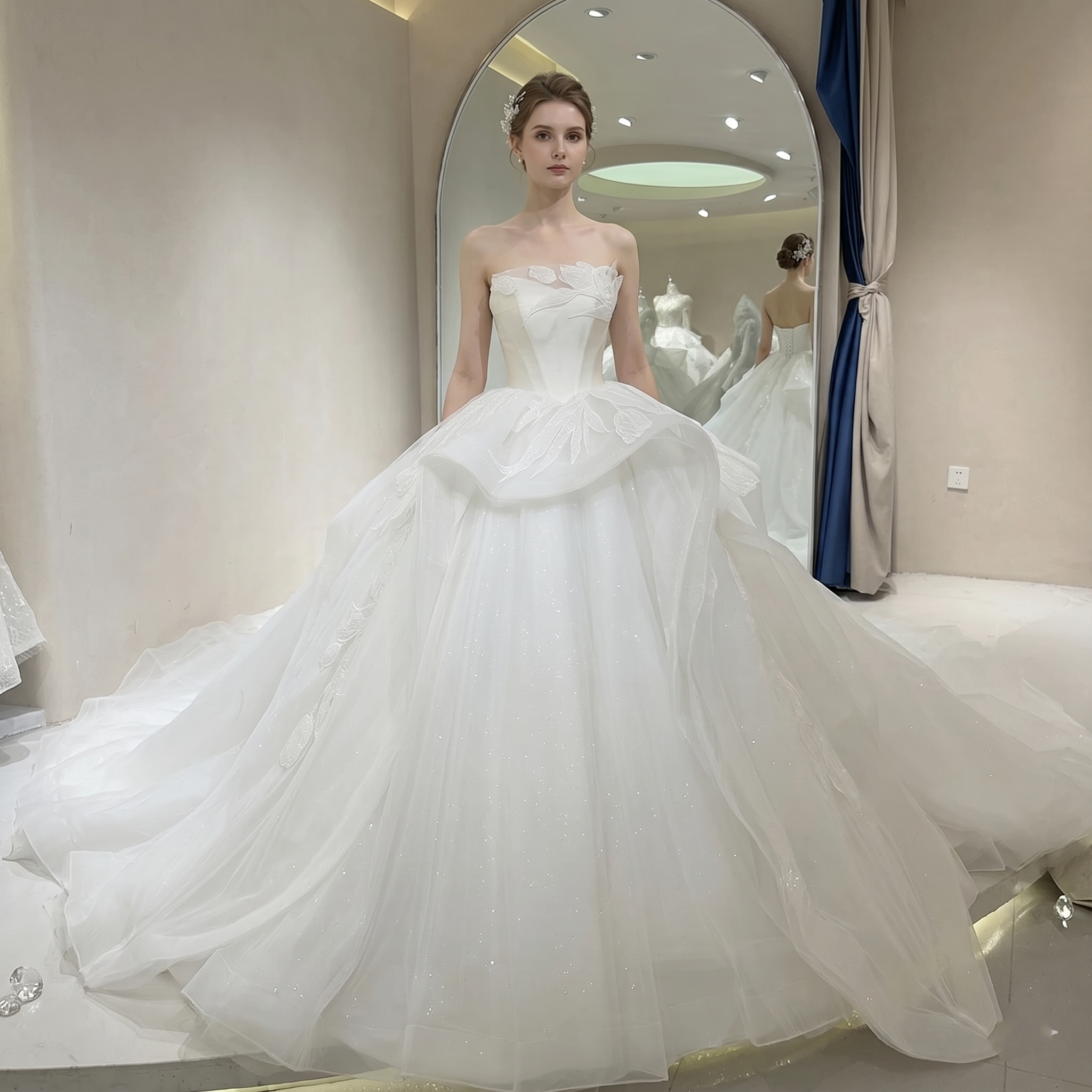 Full front view of a strapless ivory glitter princess wedding dress with a sweetheart neckline and a voluminous ball gown skirt on a mannequin.