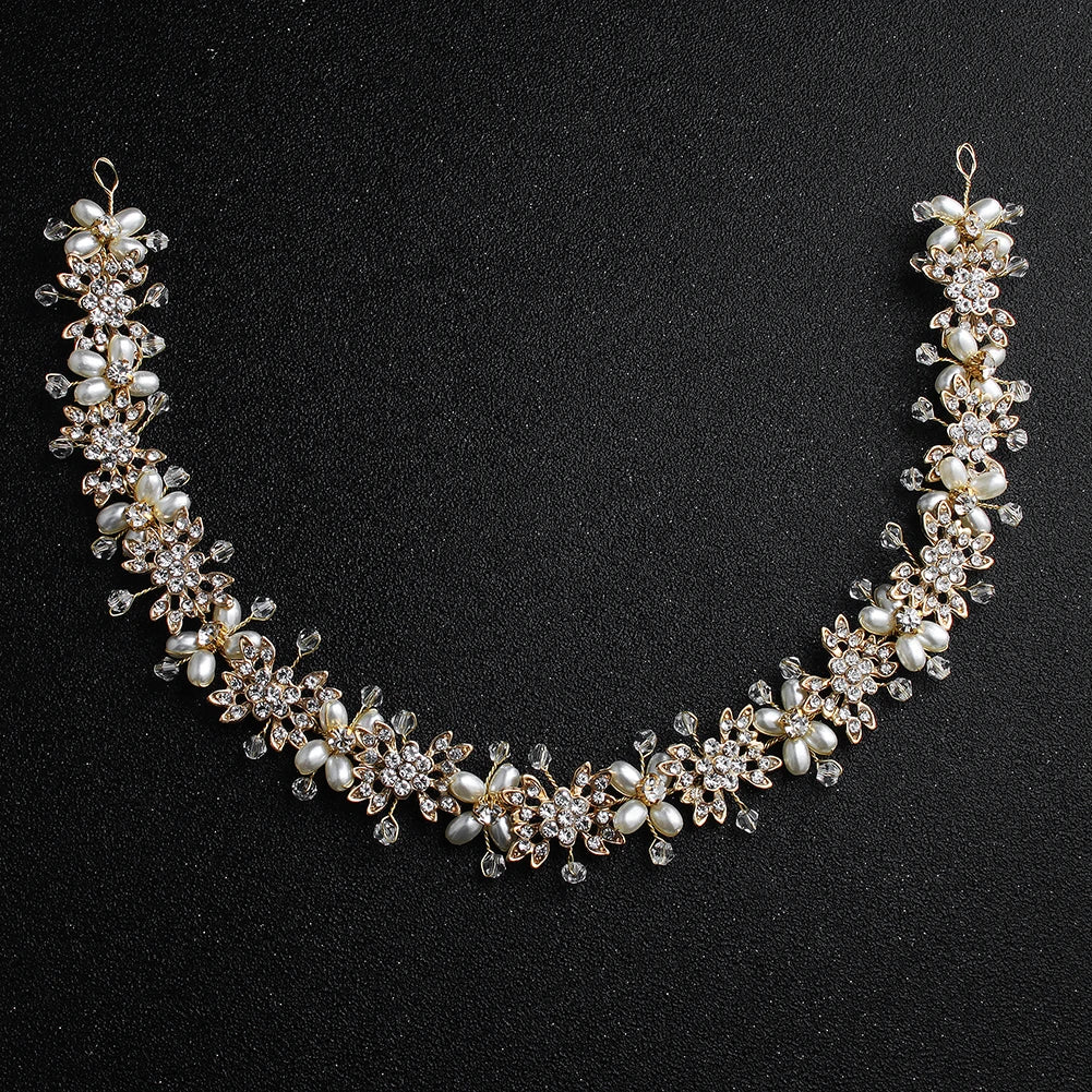 Detailed view of a gold floral pearl wedding hairband, emphasizing the delicate arrangement of petals and beads.