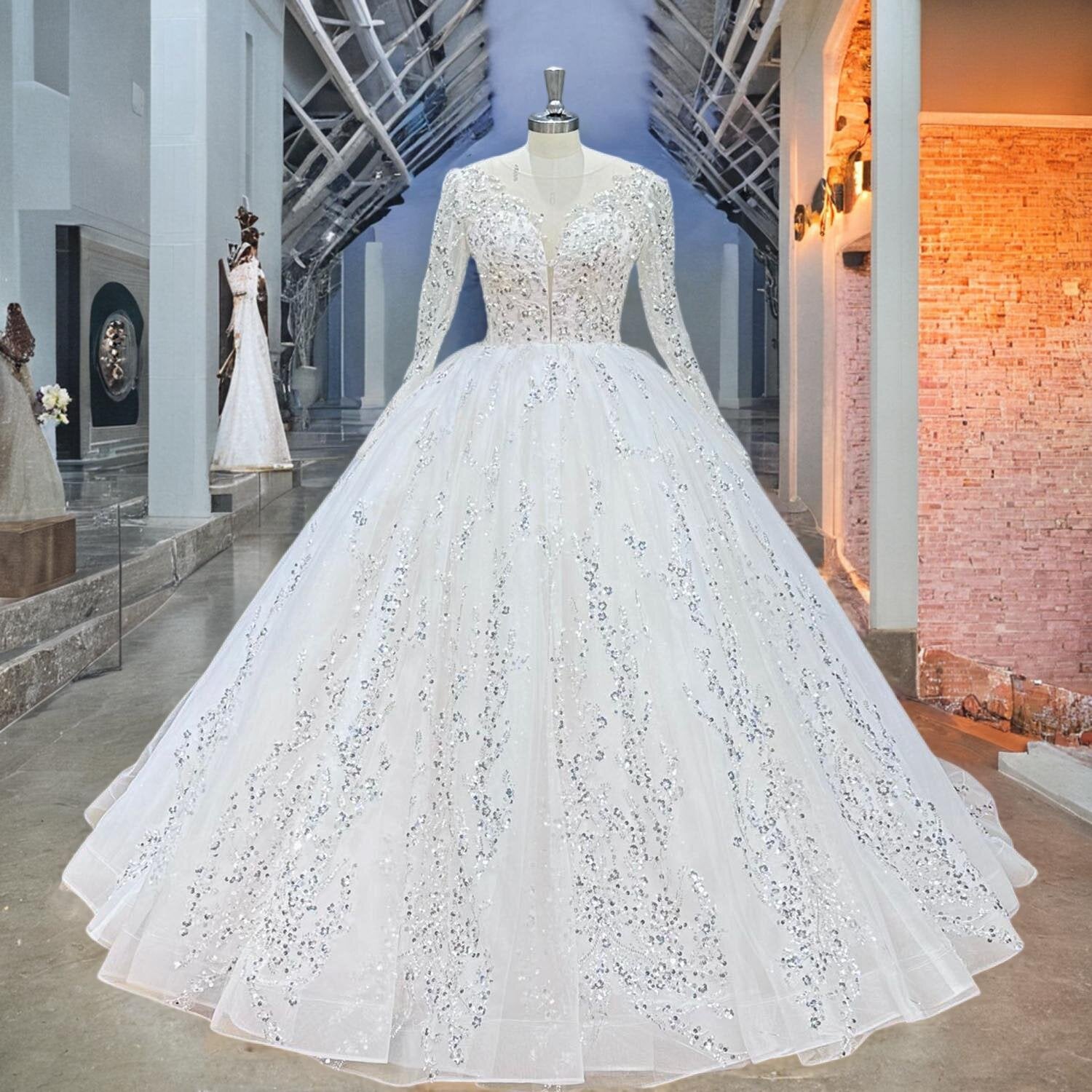 Full-length view of a classic long-sleeve ball gown bridal dress with sequin appliqué and a full skirt displayed on a mannequin.