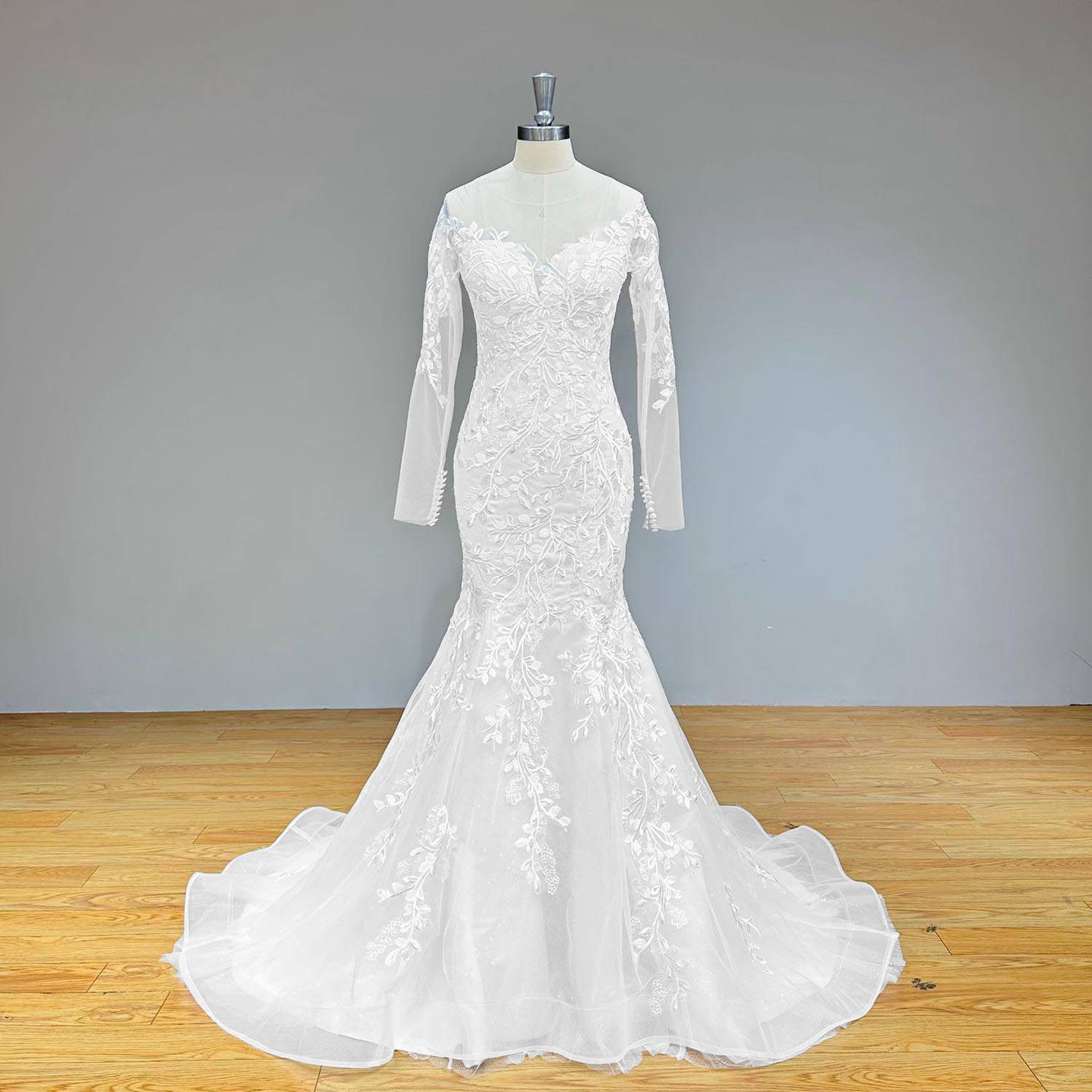 Bright full front view of an elegant vintage O-neck bridal gown on a mannequin, showcasing the complete mermaid silhouette and detailed lace floral overlays on the skirt.