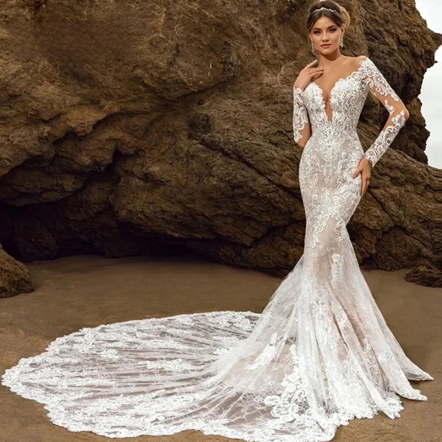 Elegant front profile of the mermaid wedding dress featuring a plunging illusion neckline, long sheer lace-covered sleeves, and delicate sequin embellishments.