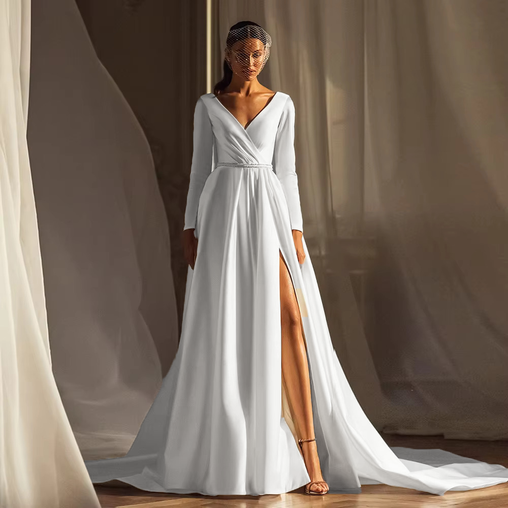 Stately pure white A-line satin wedding gown with a deep side slit and pearl belt accent, optimized for a clean, editorial look.