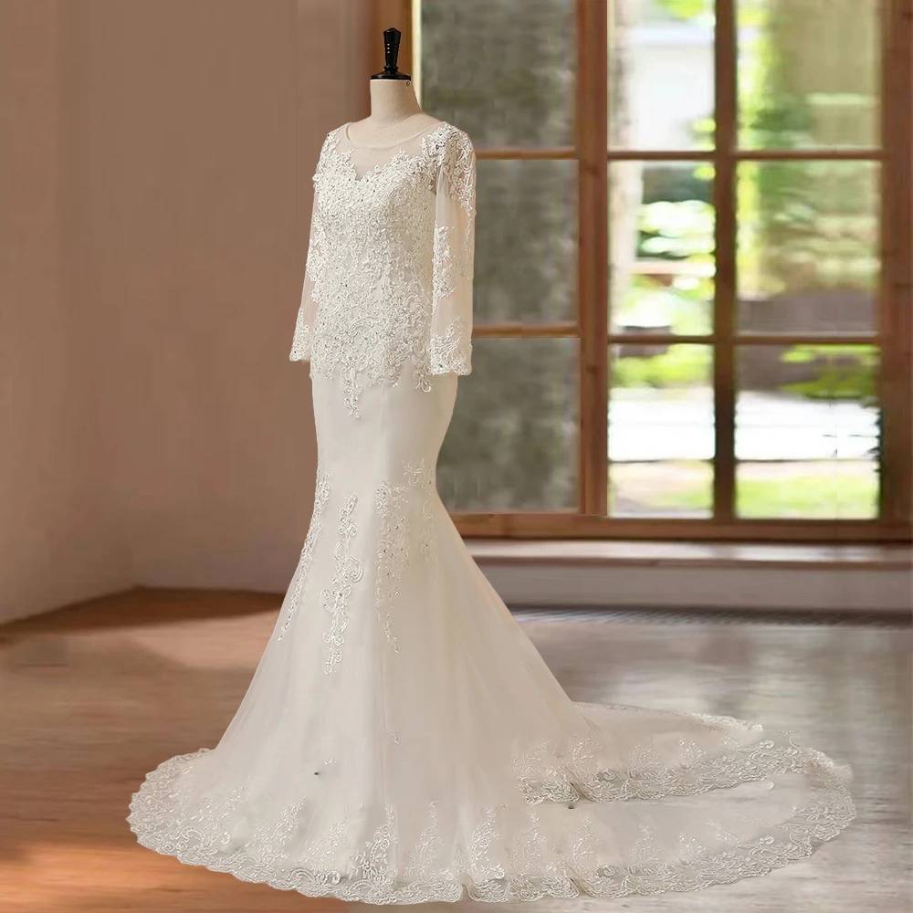 Side view of a women's long sleeve mermaid wedding dress on a mannequin featuring a delicate keyhole lace back cutout, corset lace-up closure, and a stunning circular lace-trimmed train.
