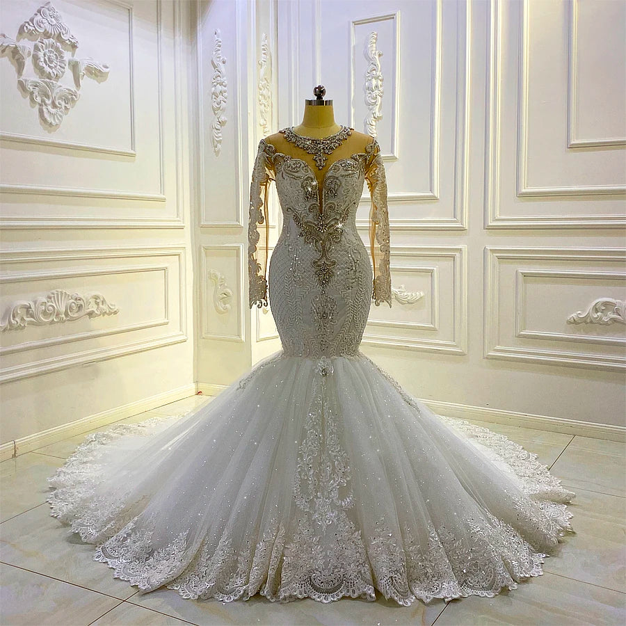 Back view of a 2-in-1 mermaid wedding dress on a mannequin, featuring a traditional lace-up corset back and a voluminous tiered ruffle cathedral train.