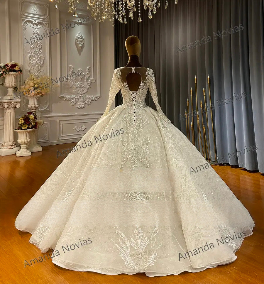 Detailed back view of the luxury bridal gown bodice, featuring a sophisticated lace-up corset back, an elegant keyhole opening, and dense shimmering embroidery cascading into the full skirt.