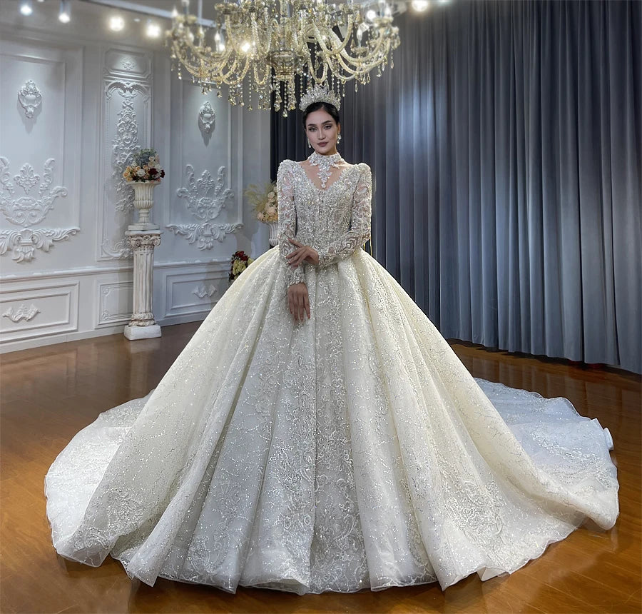 Regal ball gown wedding dress featuring a removable high-neck choker collar and heavy pearl embellishments, paired with a bridal tiara for a luxury aesthetic.