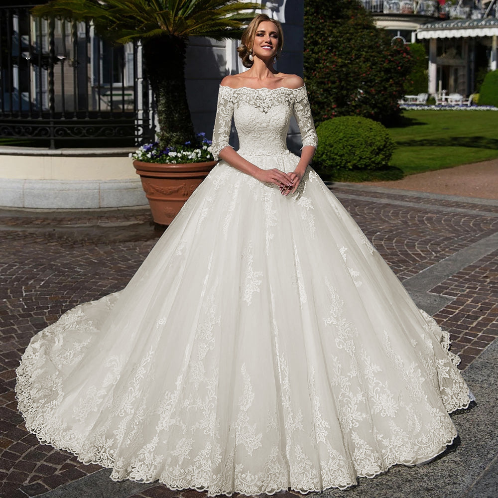 Front profile of a romantic A-line wedding dress with a boat neck and beaded three-quarter lace sleeves, perfect for a vintage-inspired bride.