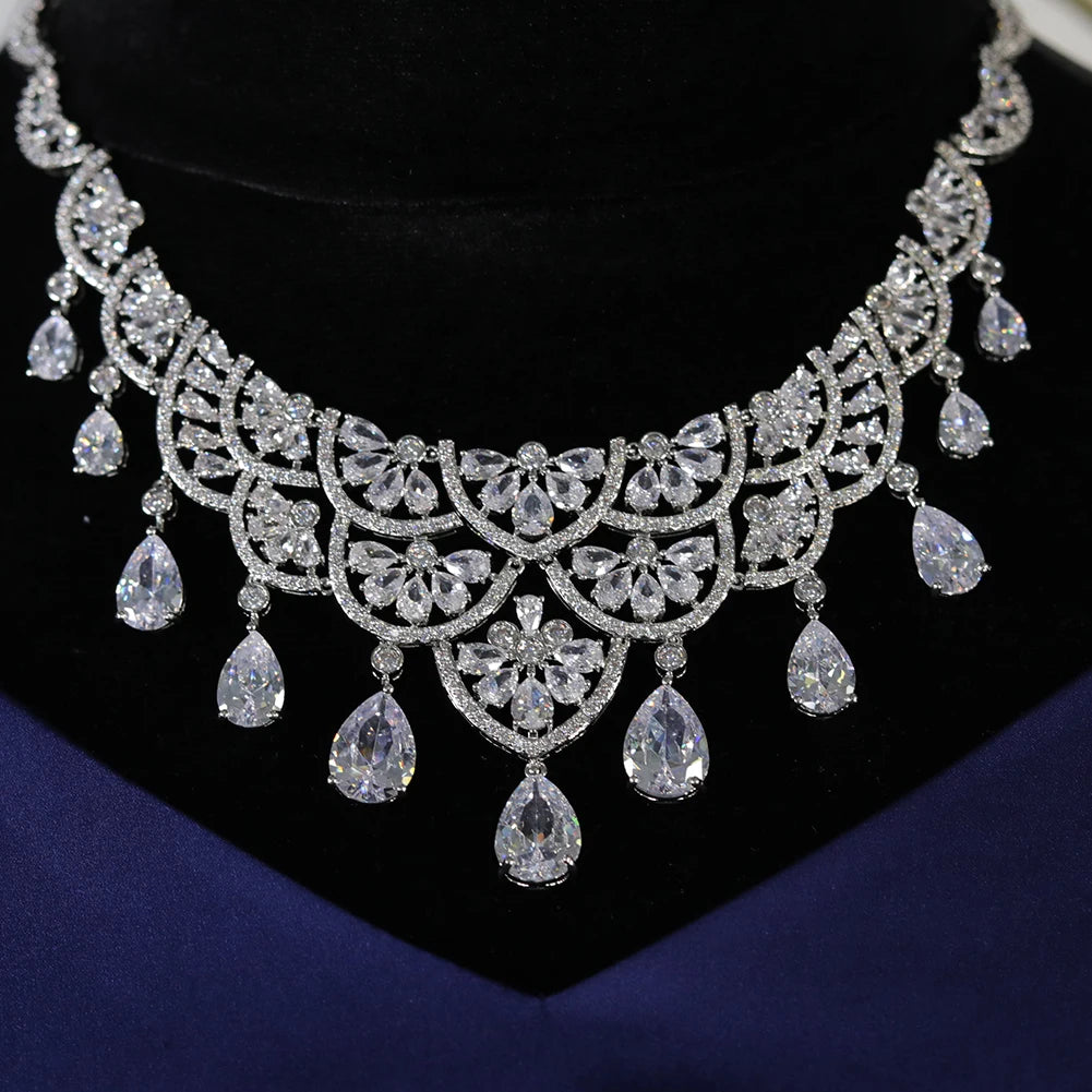 High-end crystal bridal necklace showcasing a detailed lace structure and dangling water drop pendants