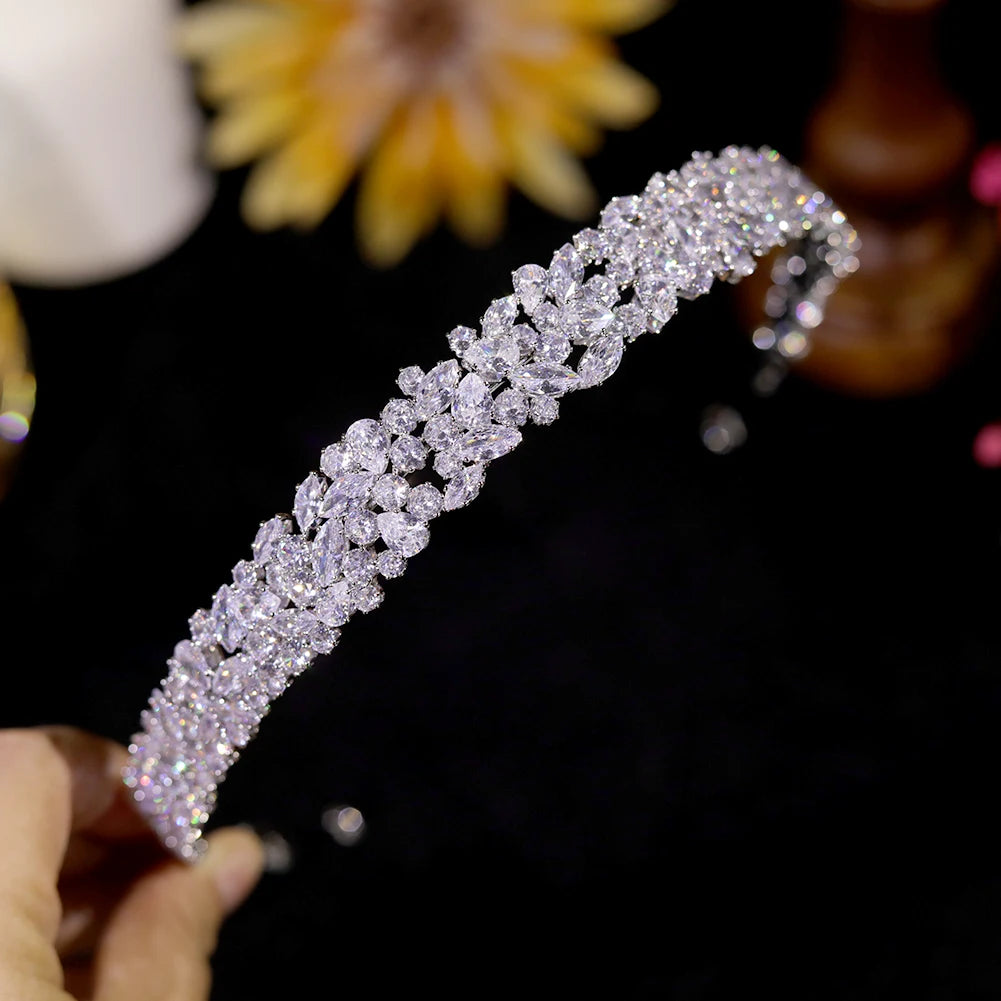 Close-up macro view of an elegant silver wedding hair accessory showcasing brilliant-cut marquise and round cubic zirconia cluster stones.