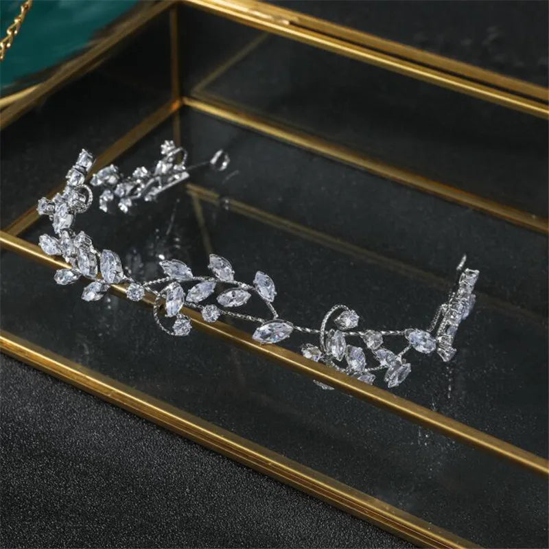 Macro detail of the intricate metalwork and sparkling cubic zirconia stones on a wedding tiara.