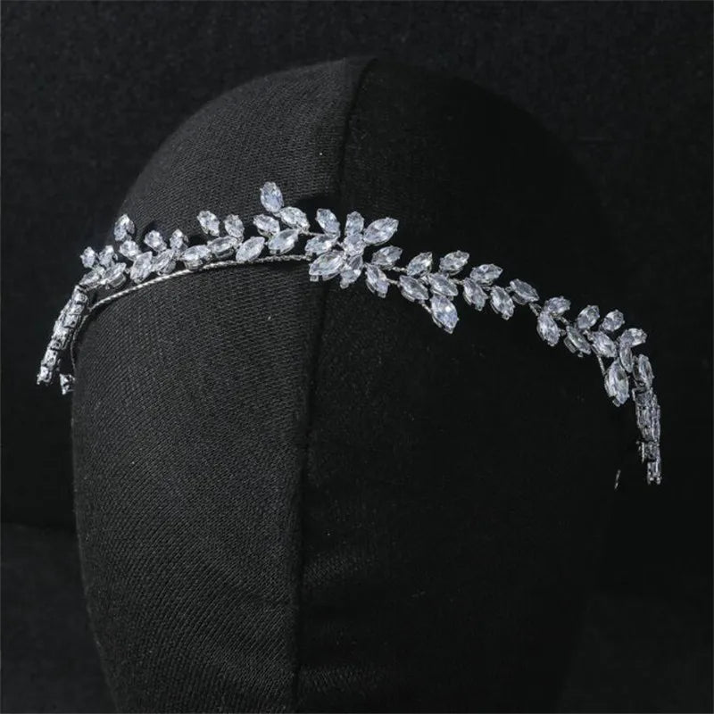 Close-up of a delicate leaf-design bridal headband worn on a mannequin.