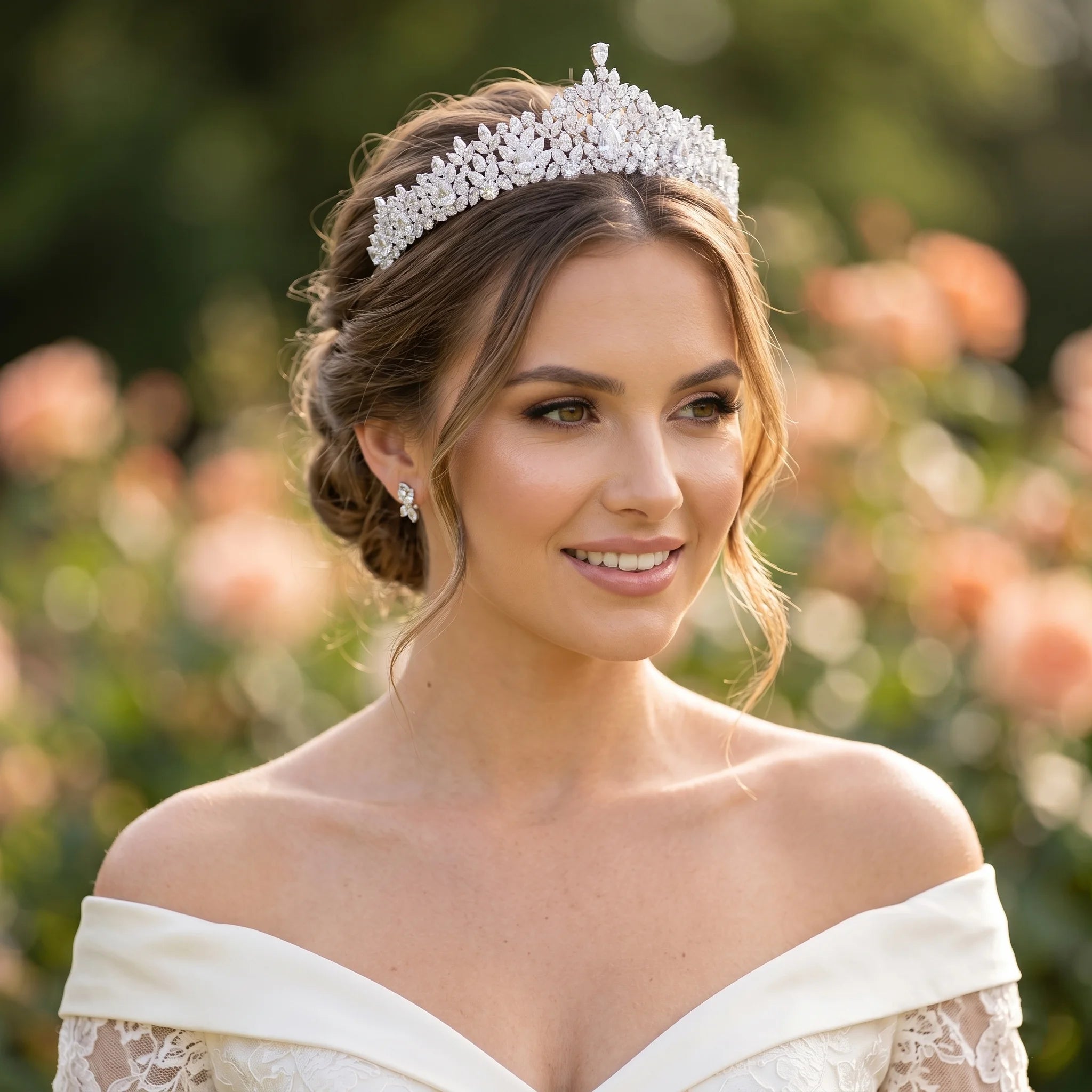 Close-up portrait of a smiling bride wearing a luxury CZ bridal tiara wedding headband with a high-pointed marquise crystal layout.