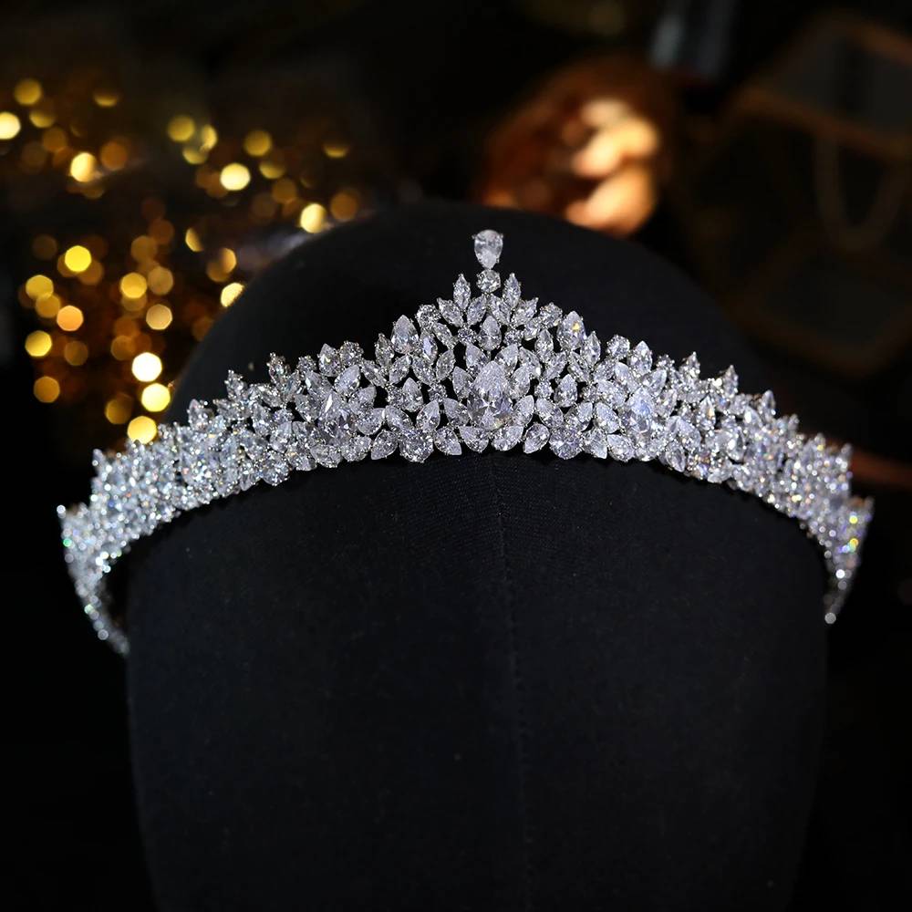 Front view of the elegant crystal princess crown wedding hair accessory for women, highlighting its bright pave reflections under soft lighting.