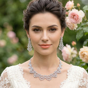 Model wearing a luxury cubic zirconia hollow necklace and matching dangle earrings for a bridal wedding look.