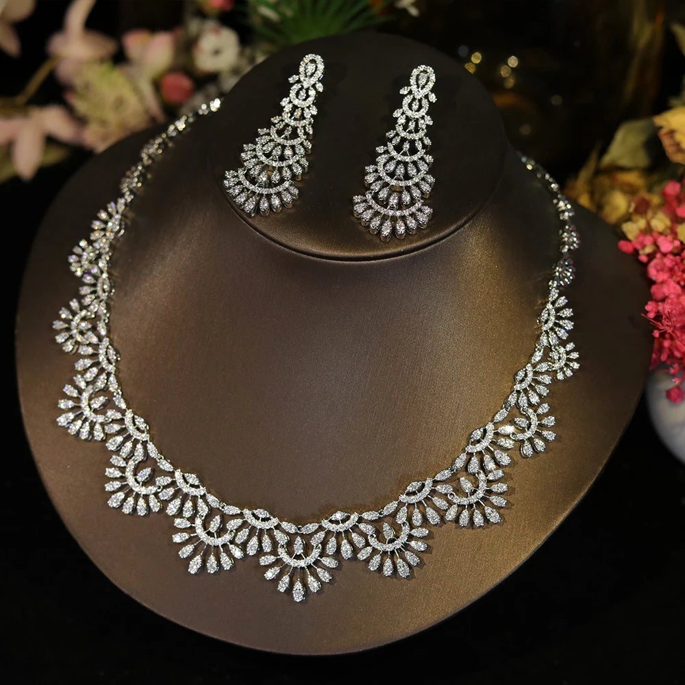 Side-angle display of a luxury CZ zircon wedding jewelry set showcasing intricate hollow lace details.