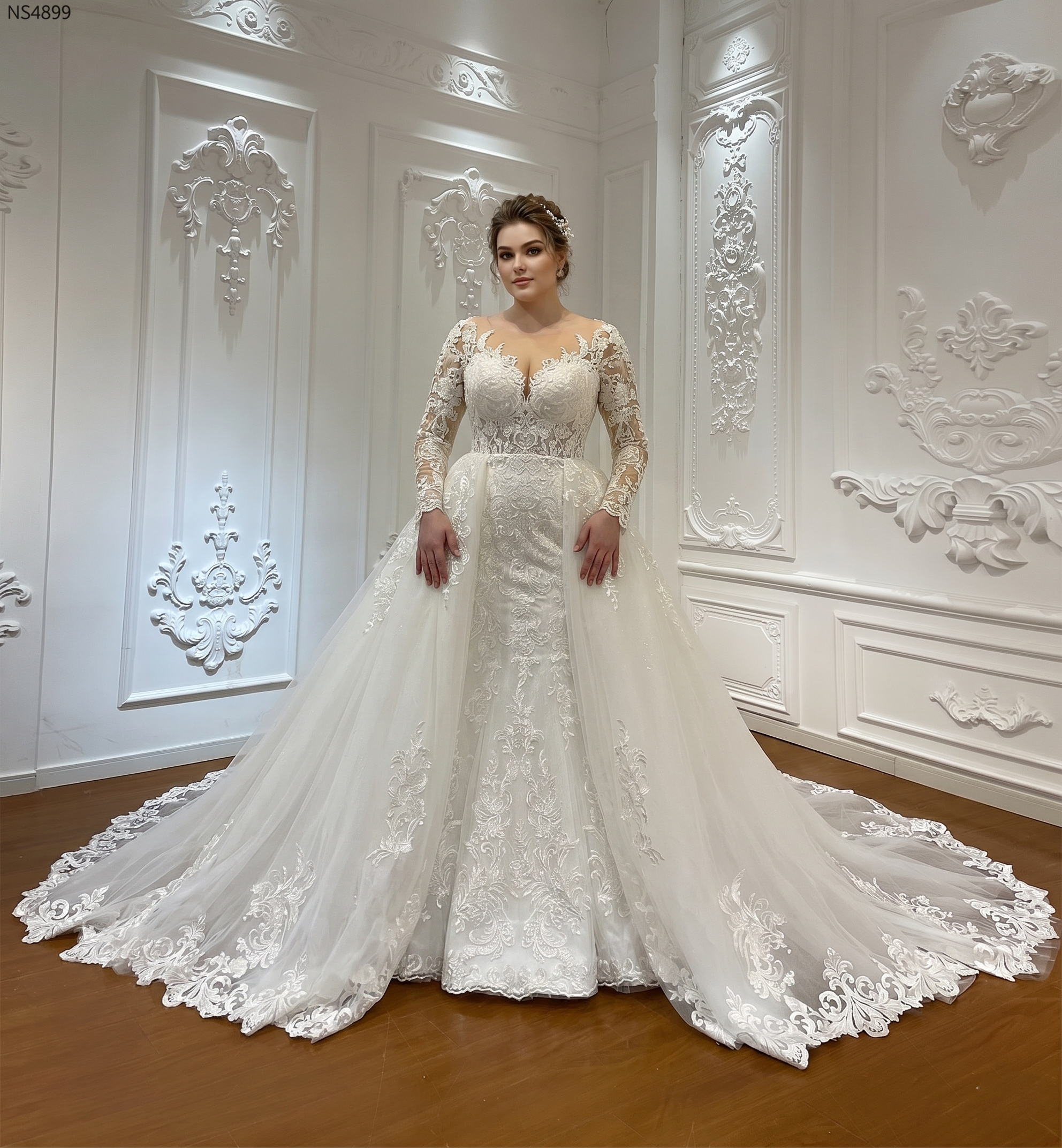 Elegant 2-in-1 bridal gown on a mannequin showcasing a heavily beaded lace mermaid dress worn under a voluminous, shimmering detachable ball gown skirt.