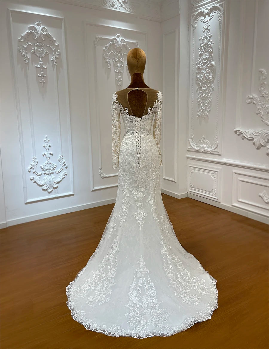 Macro detail of high-quality lace and sequin craftsmanship on the scalloped hem of a majestic royal-style wedding dress train.