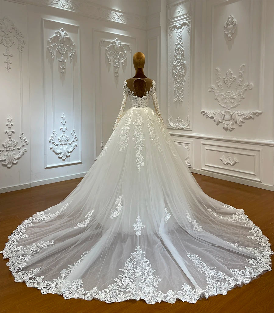 Real bride wearing a luxury two-piece lace mermaid dress with a high-volume detachable overskirt, styled for a royal bridal aesthetic.