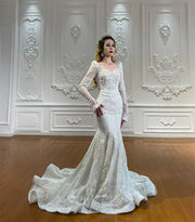 Luxury full lace, long-sleeved mermaid-style wedding dress on a model, showing intricate lace patterns and a form-fitting design without the overskirt.