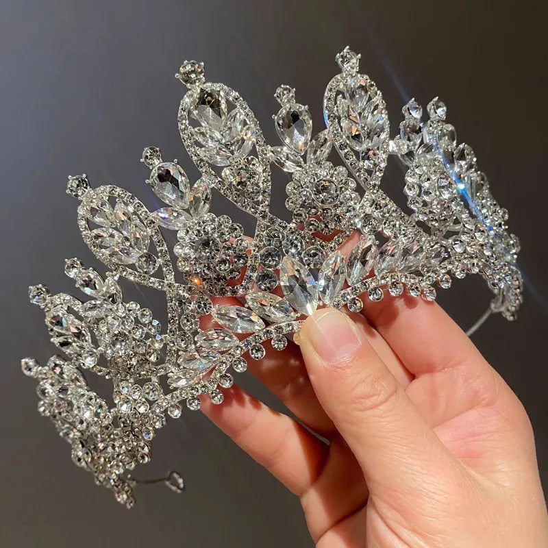 Macro view of a luxury handmade bridal crystal crown, focusing on the intricate rhinestone and crystal placement.