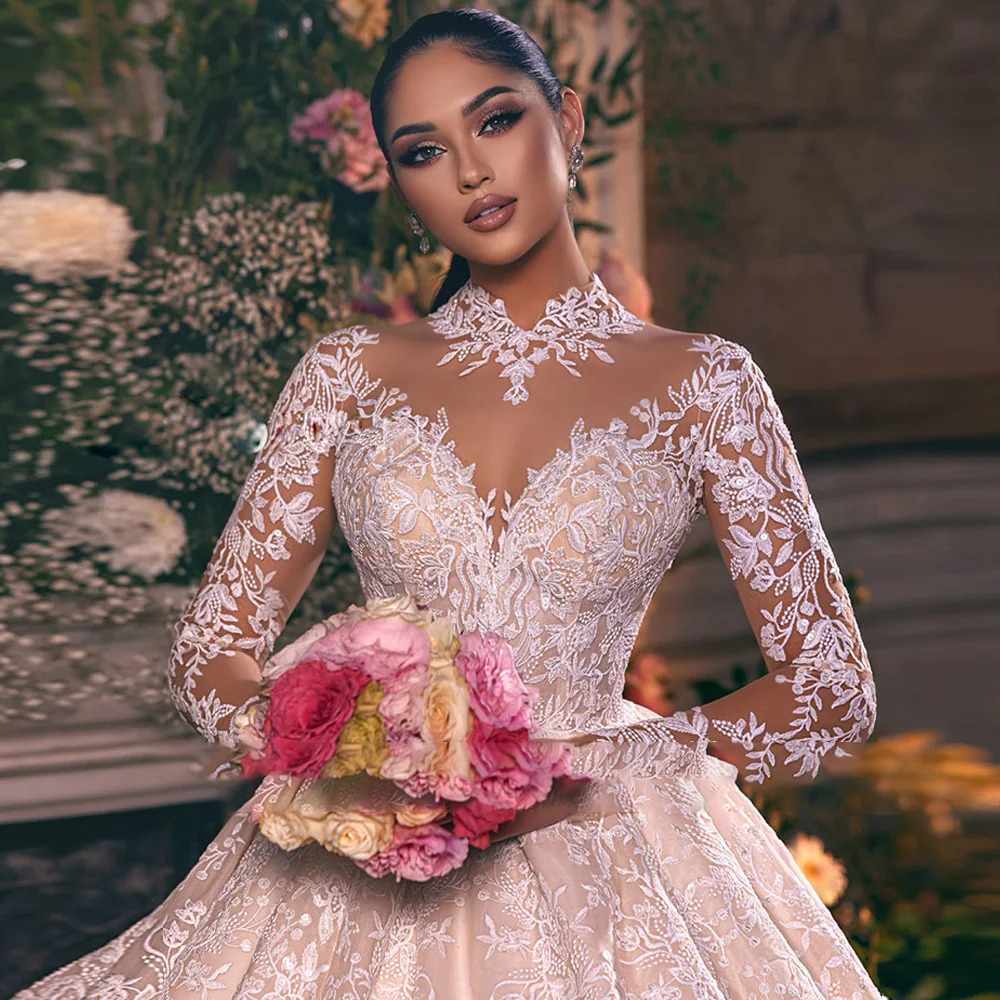 Detailed close-up of a modest O-neck wedding dress bodice highlighting elegant lace embroidery, subtle shimmering sequins, and sheer long sleeves.