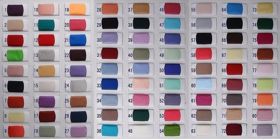 Numbered textile fabric catalog chart presenting a wide selection of premium mesh, tulle, satin, and lace color swatches for custom-tailored wedding gowns and evening dresses.