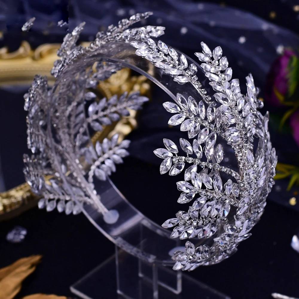 Elegant silver rhinestone wedding headband with intricate leaf motif on display