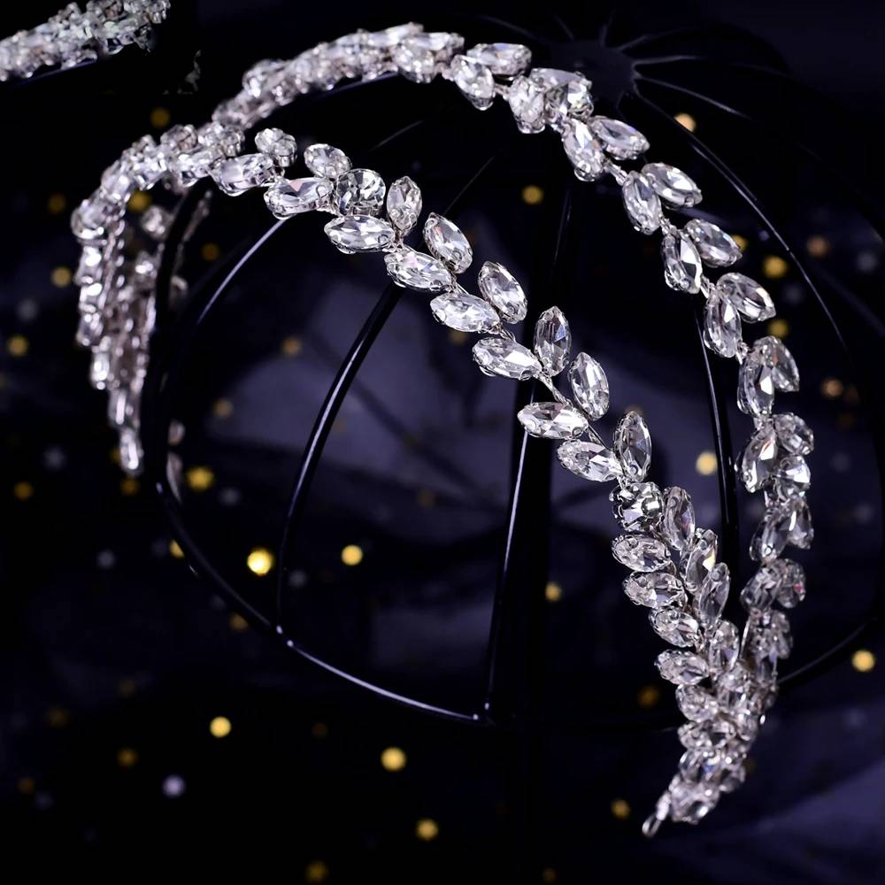 Detailed view of a silver rhinestone leaf headpiece for weddings and pageant hair accessories