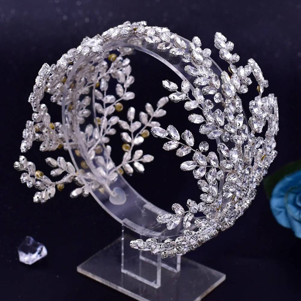 High-quality crystal leaf tiara on a clear display stand for luxury bridal headwear collections