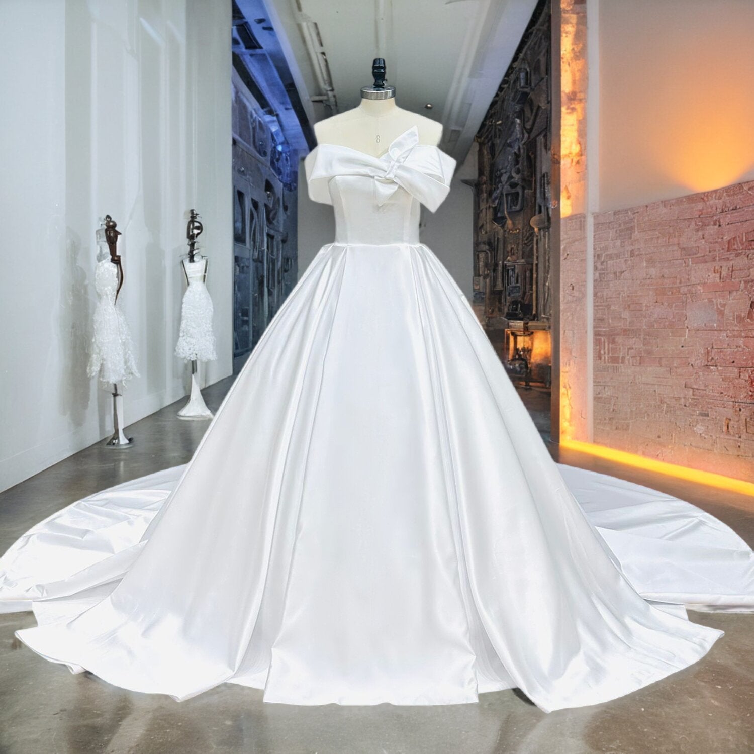 White premium satin wedding gown with a classic structured ball gown silhouette and a statement pleated cuff neckline displayed on a mannequin in a professional studio.