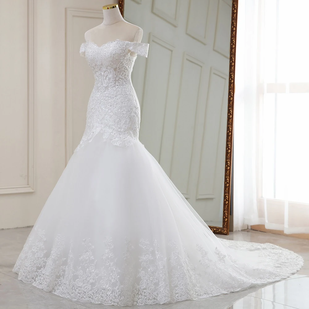 Front view of the off-the-shoulder mermaid wedding dress on a mannequin, focusing on the structured bodice and flared skirt.