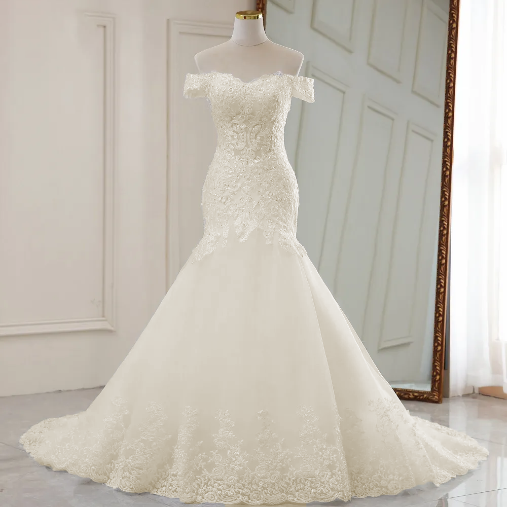 Mannequin presentation of the complete luxury off-the-shoulder mermaid bridal gown, displaying the balanced lace and tulle design.
