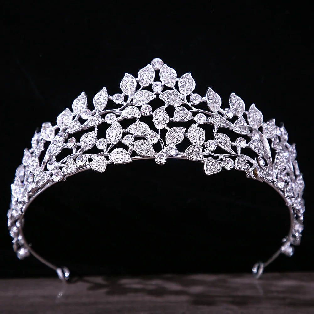 A nature-inspired silver bridal tiara beautifully crafted with leaf-shaped crystal motifs and delicate rhinestone vines.