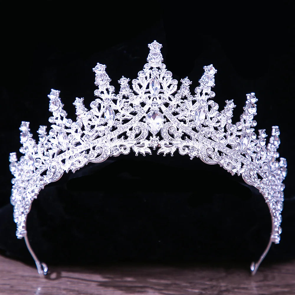 A regal silver-tone bridal crown featuring high-pointed spires and a dense cluster of brilliant rhinestones.