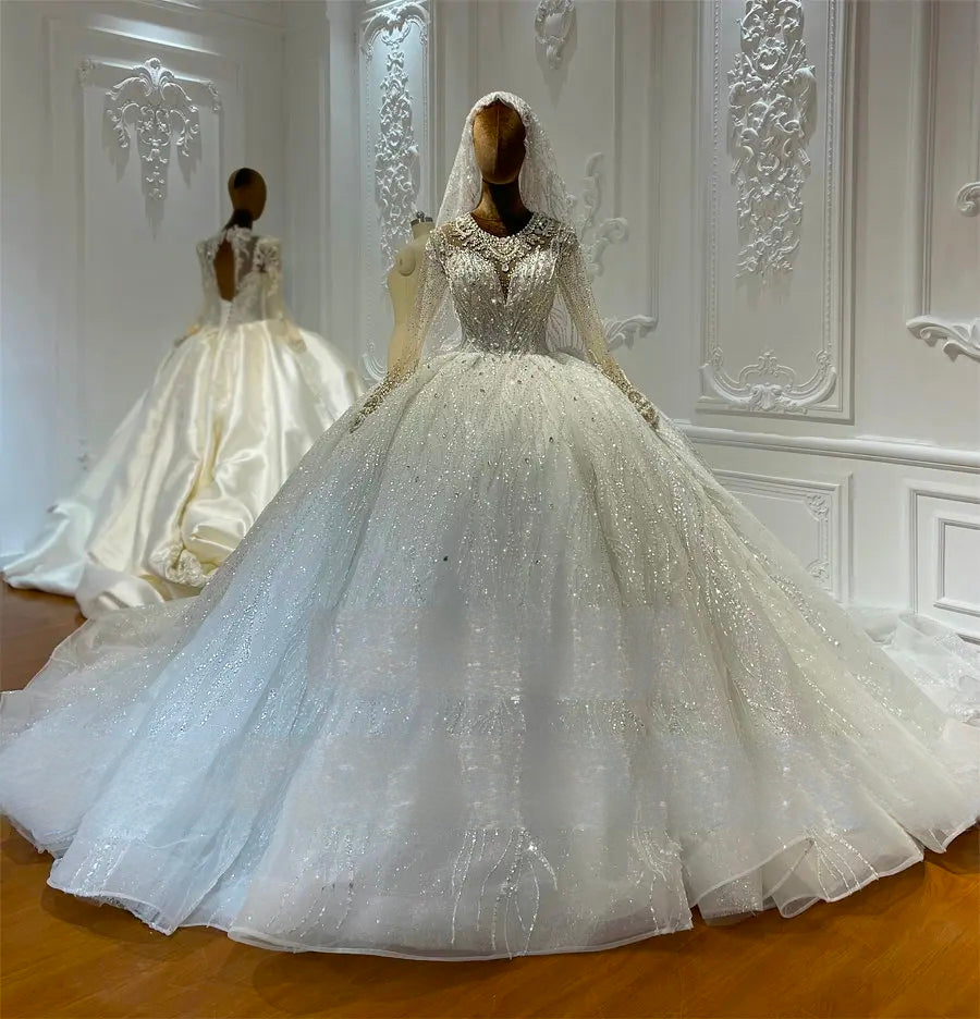 A luxury sparkling wedding dress with heavy beading and a voluminous lace skirt displayed on a mannequin, highlighting the structured fit and premium craftsmanship.