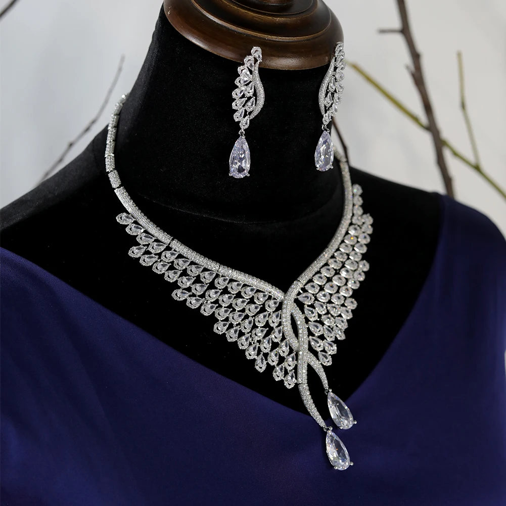 Side angle of a premium silver cubic zirconia bridal necklace set, highlighting the cascading feather-inspired crystal pattern.