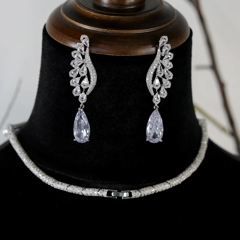 Rear angle view showing the detailed pave clasp of a silver wedding choker necklace with matching feather dropdown earrings.