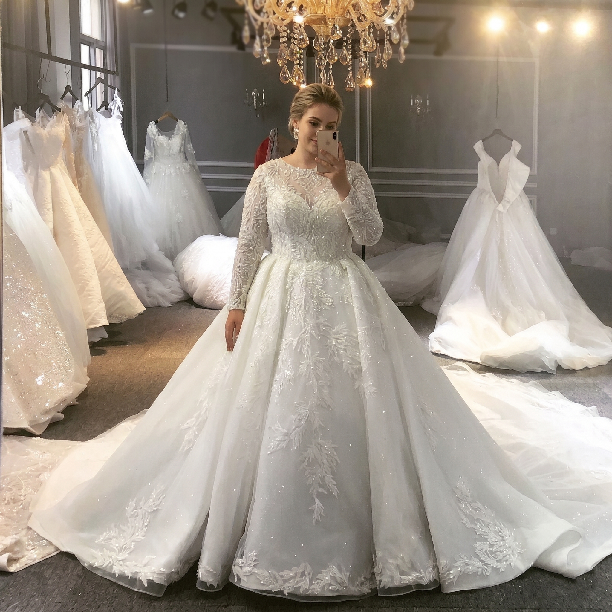 Modest white long-sleeve bridal gown with a high illusion lace neckline and a sparkling ball gown skirt, designed for a luxury Muslim wedding.