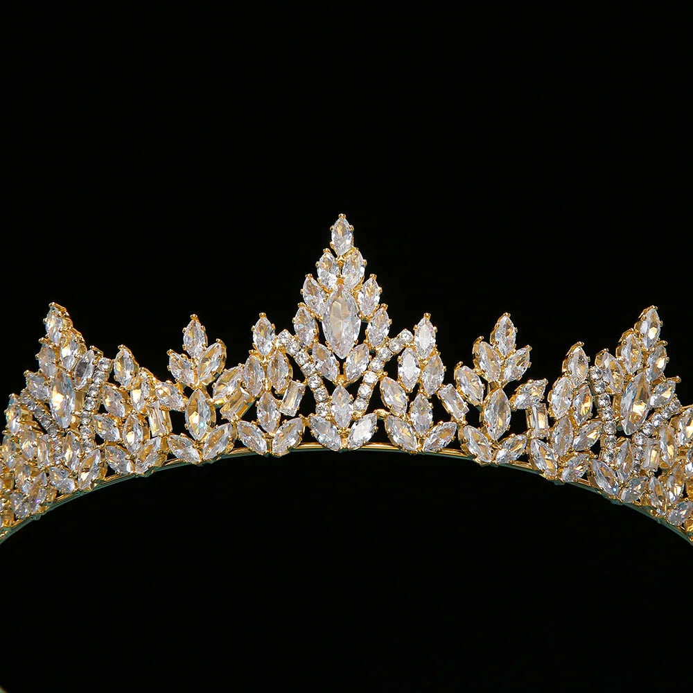 Detailed close-up of a luxury gold bridal crown showcasing the intricate arrangement of sparkling zircon gemstones.