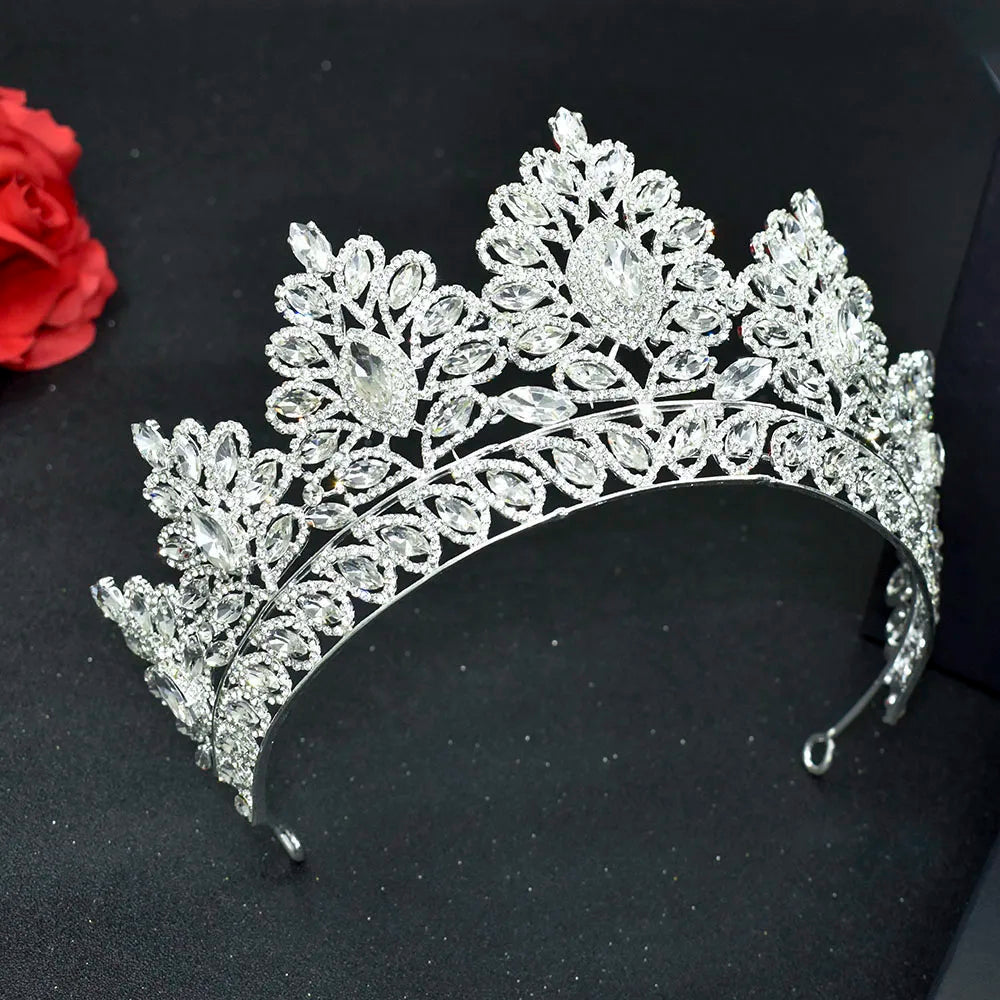 Side view of a majestic silver zircon crystal pageant headpiece adorned with heavy leaf-shaped crystal clusters.