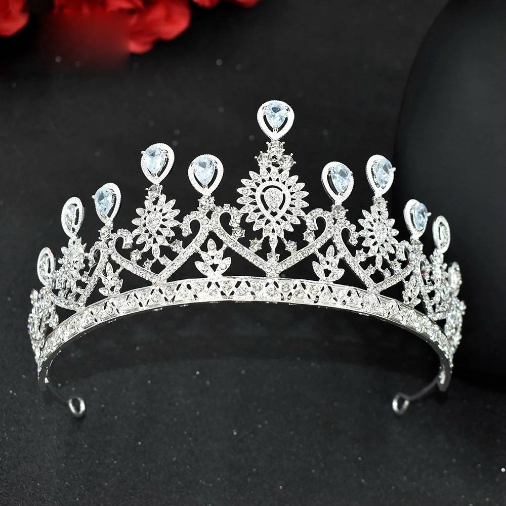 Front view of a symmetric silver zircon crystal wedding tiara headband featuring teardrop-shaped crystal tips and sharp peaks.